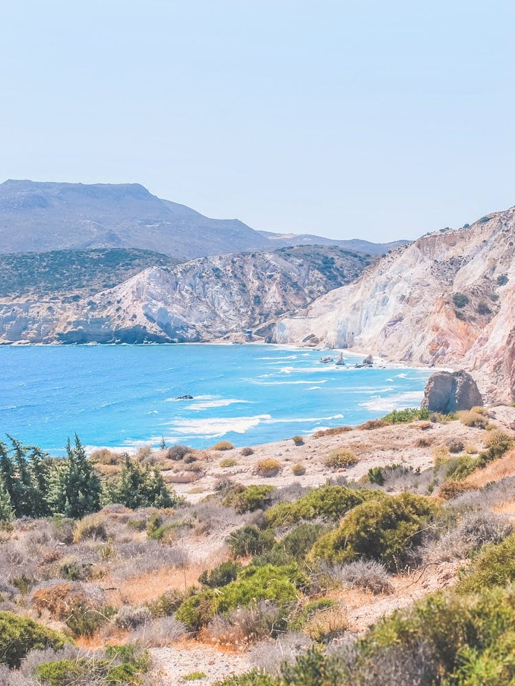 Milos, Greece I Wild bohemian boho beach Tsigrado photography in the Cyclades mountains on the Mediterranean Sea for greek landscape skyline in Fyriplaka with pastel coastal summer aesthetic vibes fine art photo