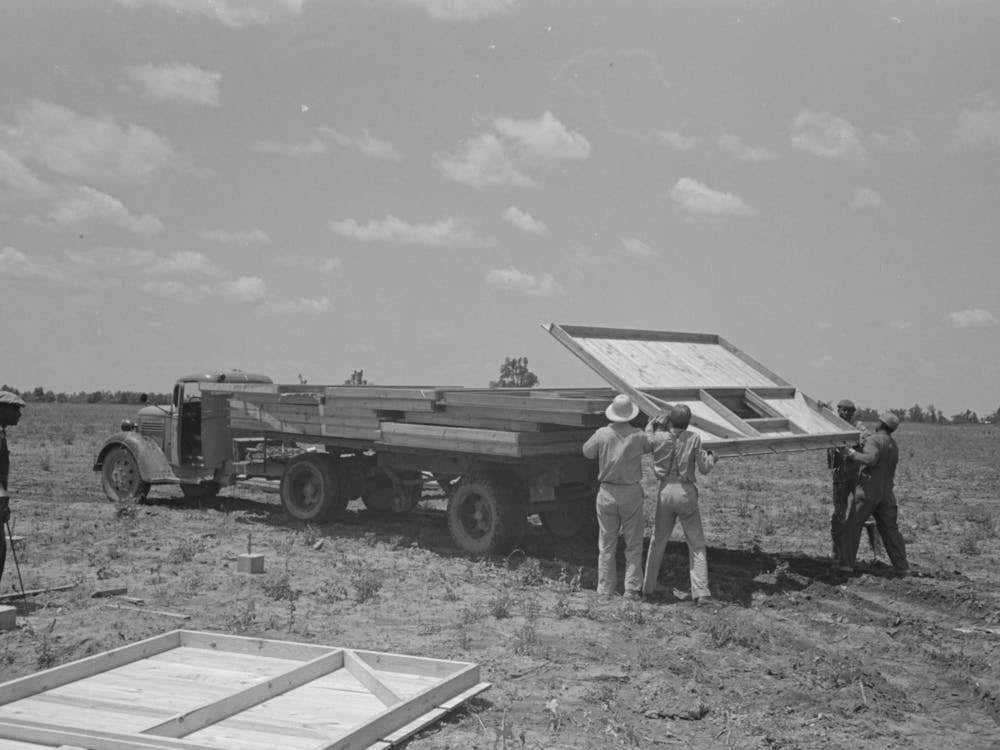 Barn Erection, Unloading Barn Panels Around Circumference Of The Foundation, These Panels Were Loaded In Order Of
