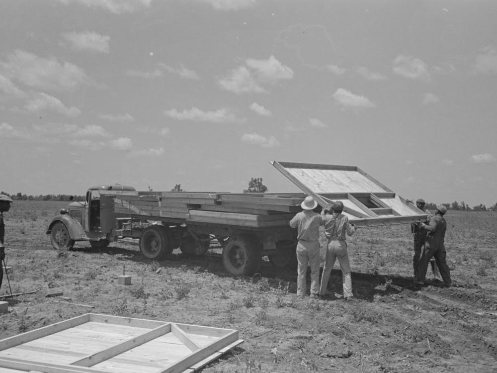 Barn Erection, Unloading Barn Panels Around Circumference Of The Foundation, These Panels Were Loaded In Order Of