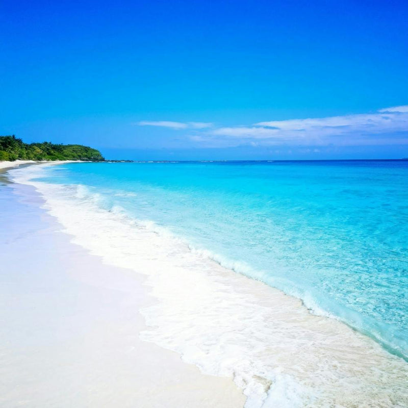 Crystal Clear Turquoise Waters Gently Lap Upon A Sun Drenched Undisturbed Sandy Beach With A Prist (2)