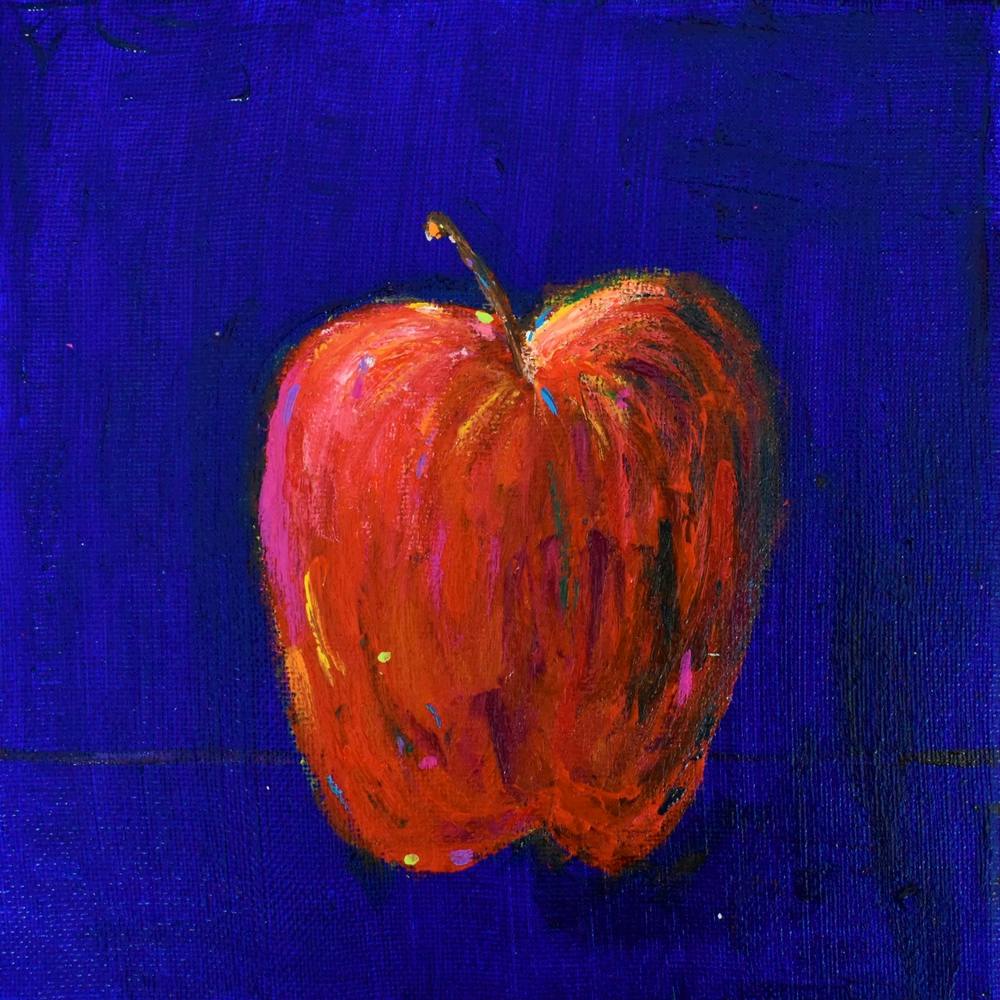 Roter Apfel auf blauem Quadrat