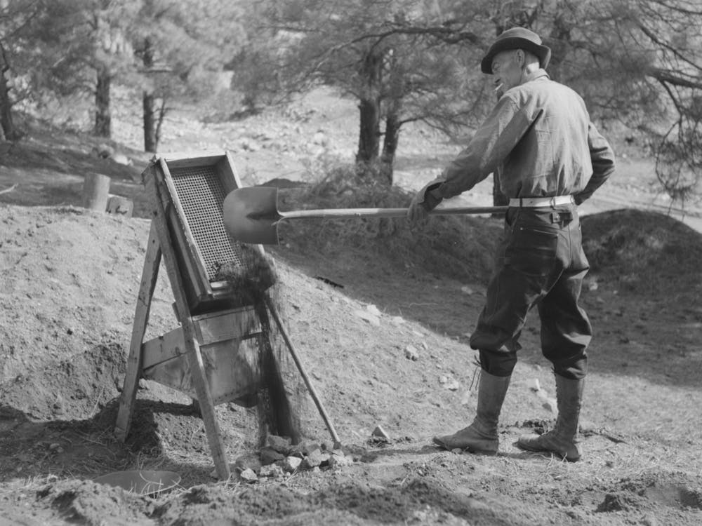 Prospector Throwing A Shovel Of Gold Bearing Dirt Into The Papago, Pinos Altos, New Mexico By Russell Lee
