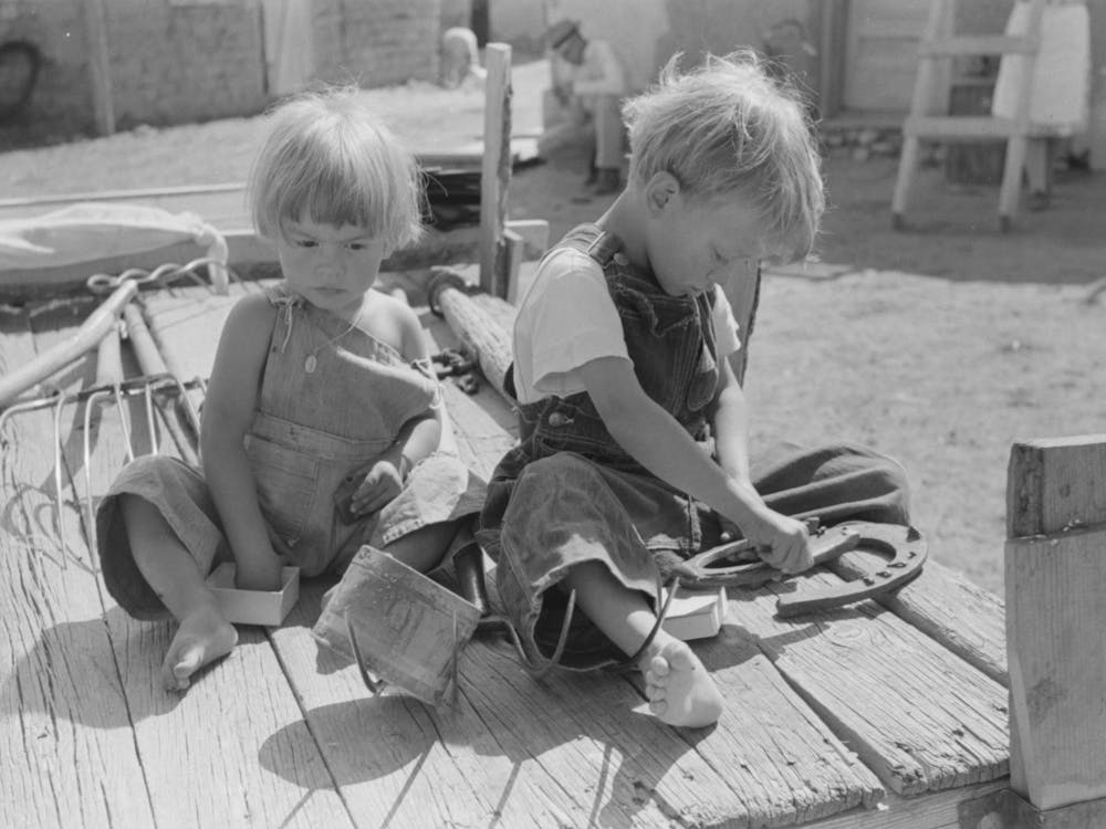Children Of Spanish American Farm Family Playing On Wagon, Taos County, New Mexico By Russell Lee