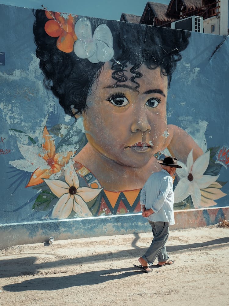 Street Art Girl With Flowers On Isla Holbox Mexico