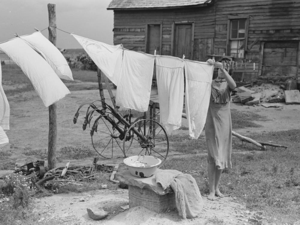 Daughter Of Tenant Farmer Hanging Up Clothes Near Warner, Oklahoma By Russell Lee 1