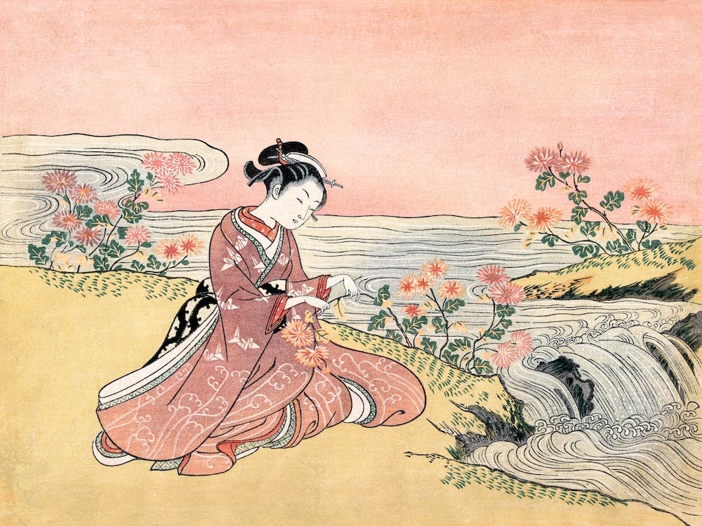Japanische Frau, die Chrysanthemen pflückt