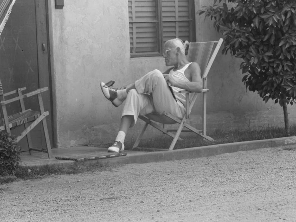 Sun Bather Swatting Fly, Tourist Court At Phoenix, Arizona By Russell Lee