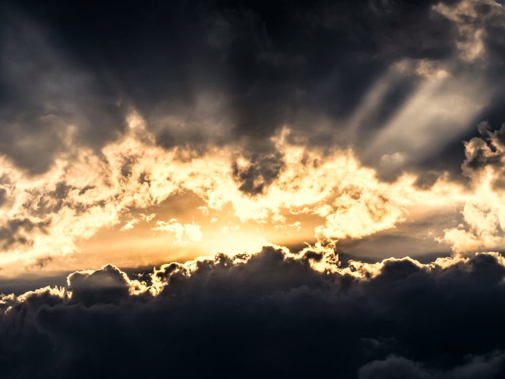 The Bright Sun Breaks Through The Dark Clouds