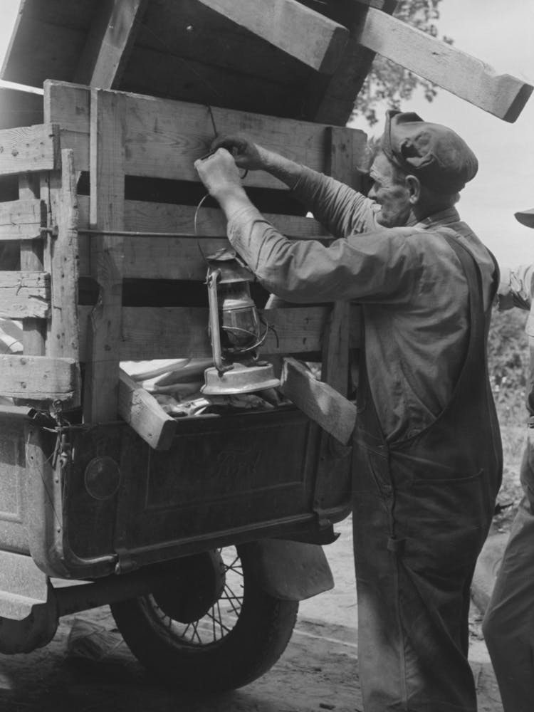 Tying Lantern Onto The Back Of Improvised Truck Which Will Travel To California Near Muskogee, Oklahoma B