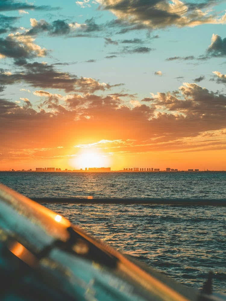 Cloudy Sky Sunset Over The Ocean