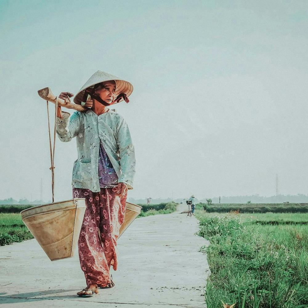 Asian Woman Carrying Buckets