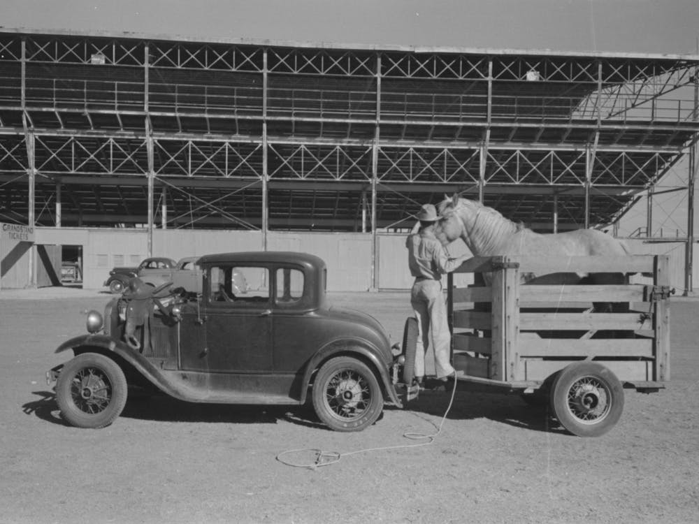 Rodeo Performer Arriving At The San Angelo Fat Stock Show Barn With His Horse In Trailer, San Angelo, Texas By