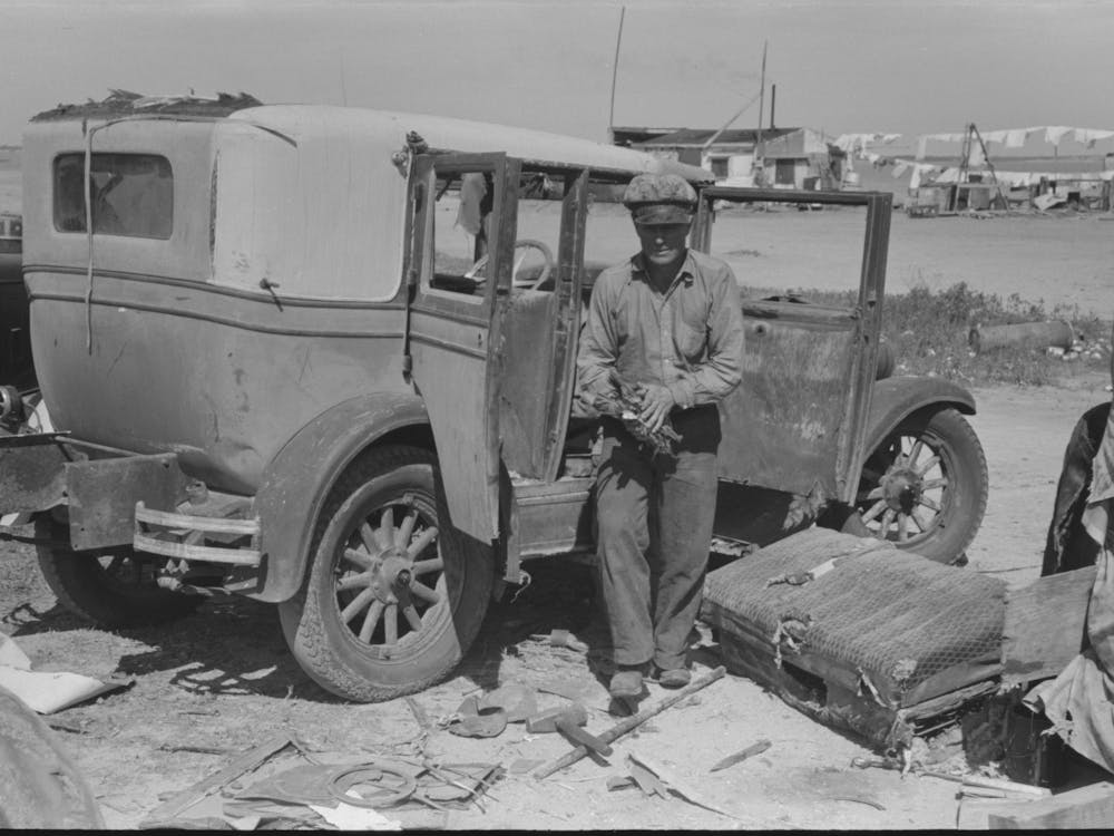 Migrant Auto Wrecker In Front Of Car Which He Will Dismantle, Corpus Christi, Texas By Russell Lee