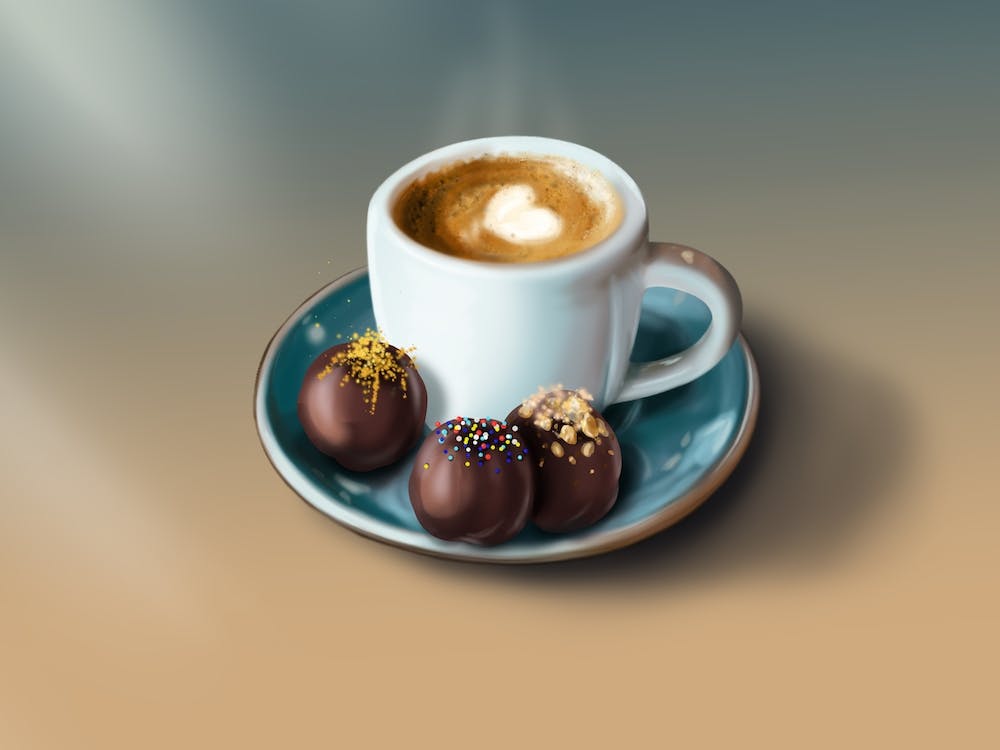 Une tasse de café chaud avec un chocolat.