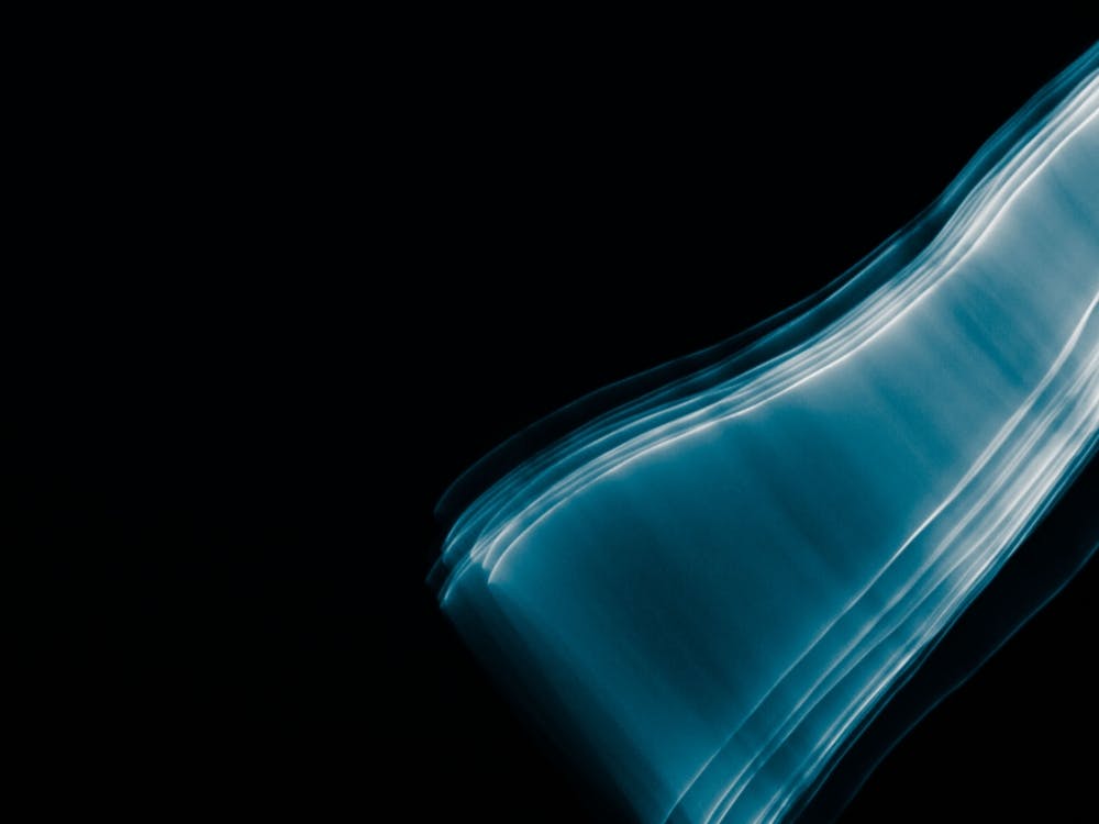 Glowing Abstract Curved Blue And White Lines