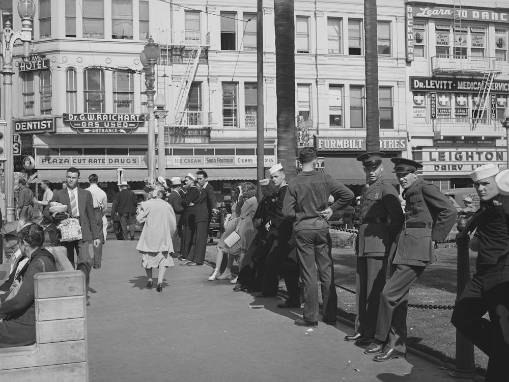 Sailors Lined Up Against Chain Rail In Square In Midtown, San Diego, California By Russell Lee