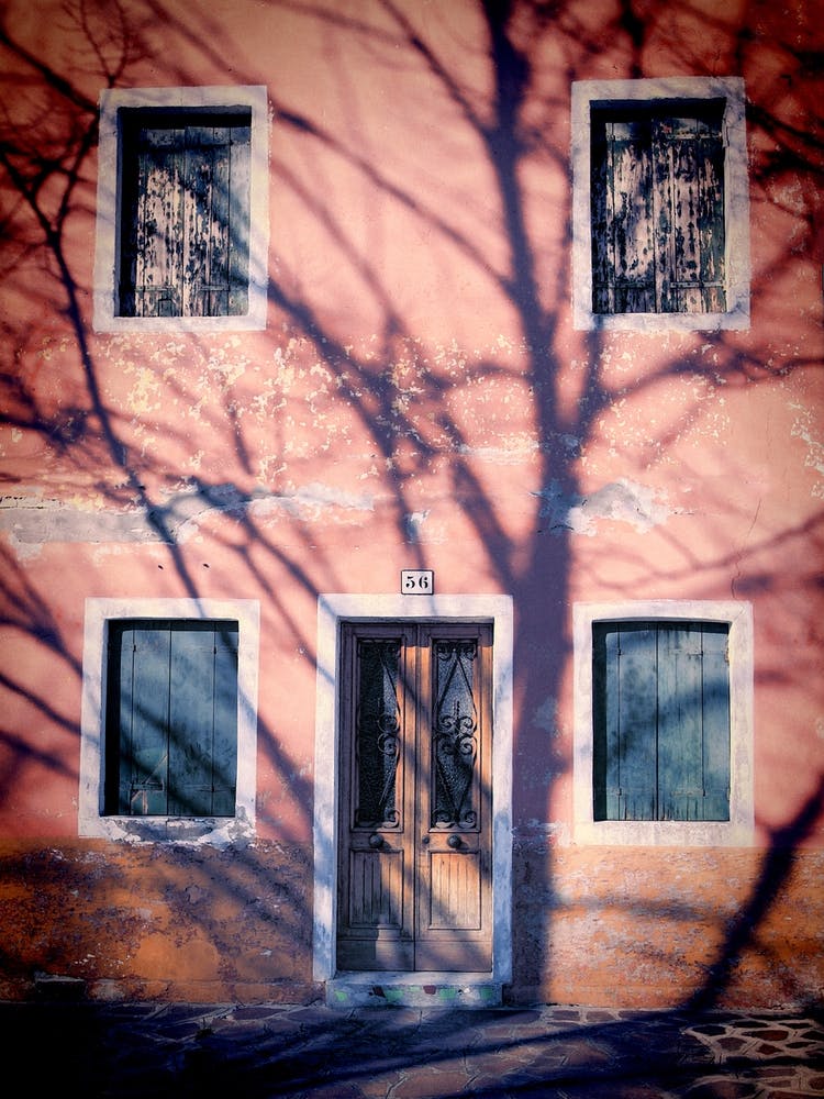Tree Shadow And Weathered House In Burano