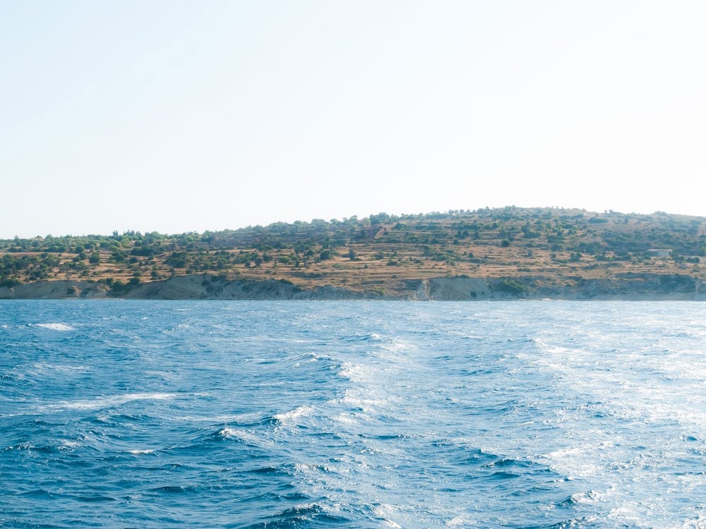 Land over blue waves