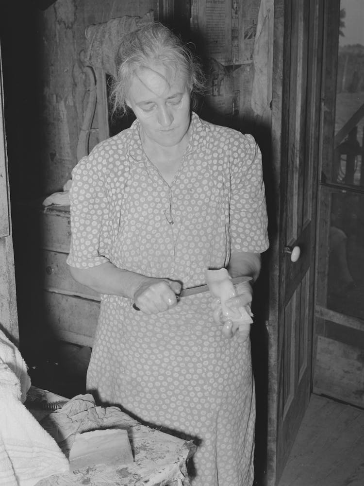 Wife Of Tenant Farmer Slicing Fatback For Noonday Meal Near Muskogee, Oklahoma, See General Caption 20 By