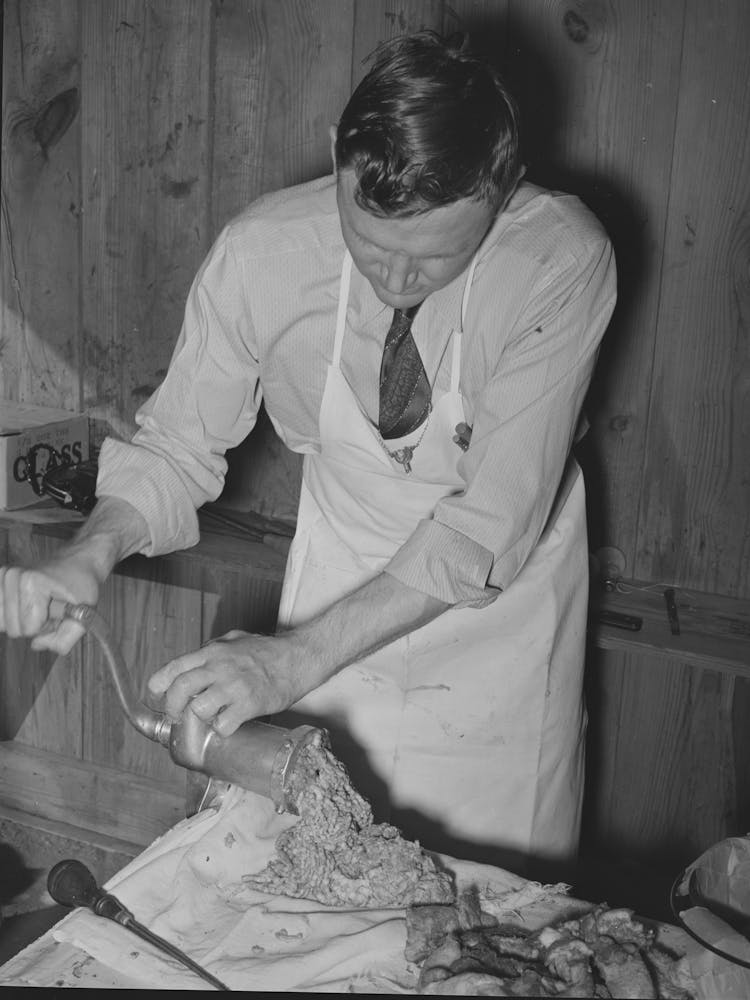 Fsa (Farm Security Administration) Supervisor Making Sausage During A Meat Cutting Demonstration Before Fs