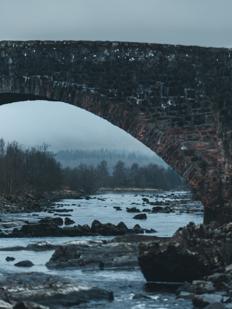 Stone Bridge Over River