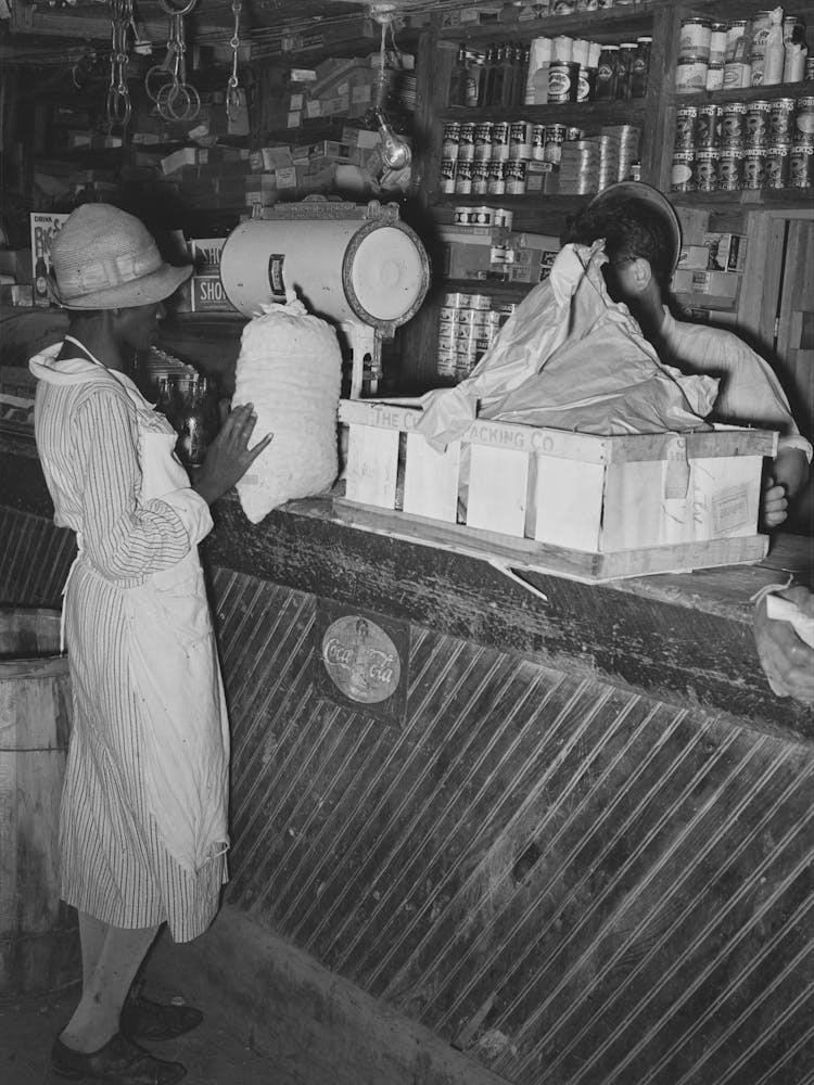 Woman Trading Sack Of Pecans For Groceries In General Store, Jarreau, Louisiana By Russell Lee