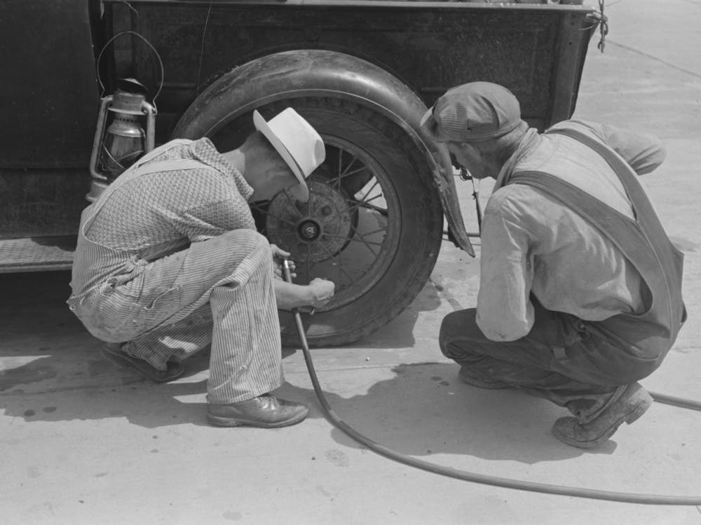 Migrants On The Road Checking Tires At Filling Station Near Henrietta Oklahoma By Russell Lee