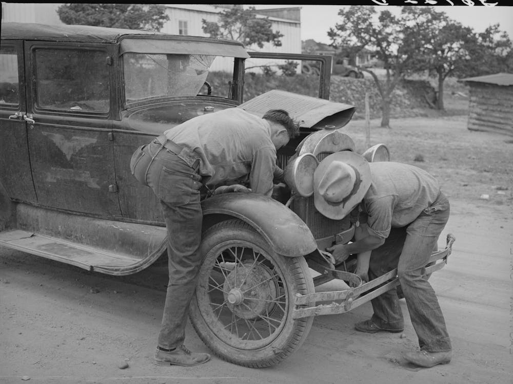 Garage Owner And Farmer Working On A Car, Pie Town, New Mexico, The Young Man Who Owns The Filling Station, Smith