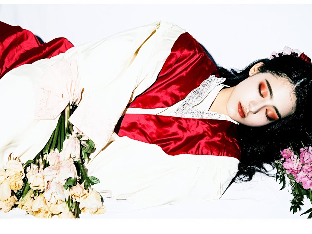 Asian Woman With Flowers