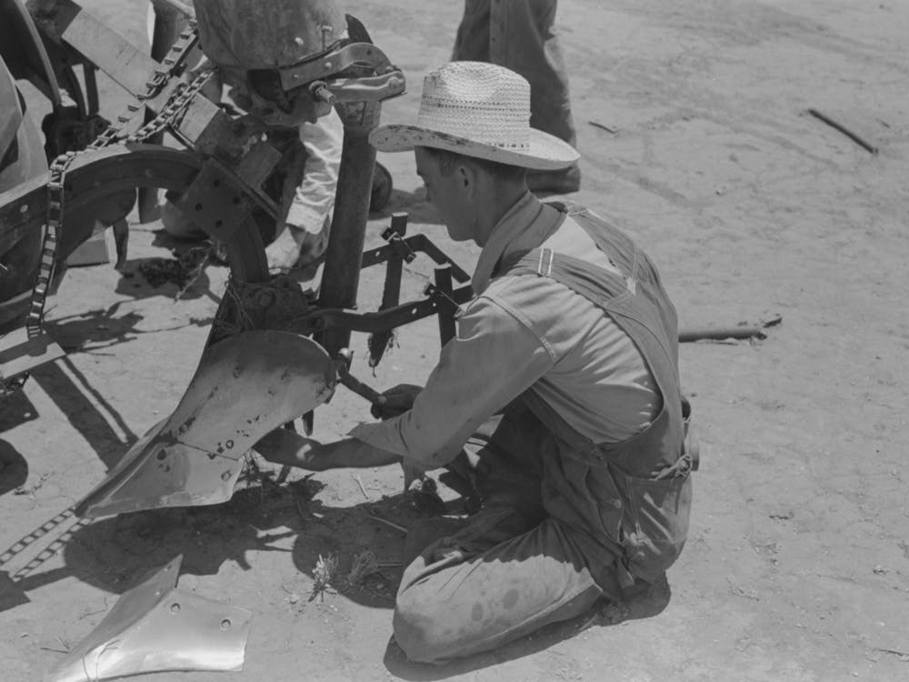 Day Laborer Adjusting Plow Points On Tractor Drawn Planter, Farm Near Ralls, Texas By Russell Lee