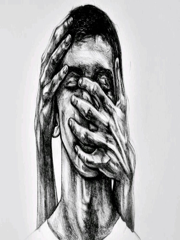 Man With His Hands Covering His Face
