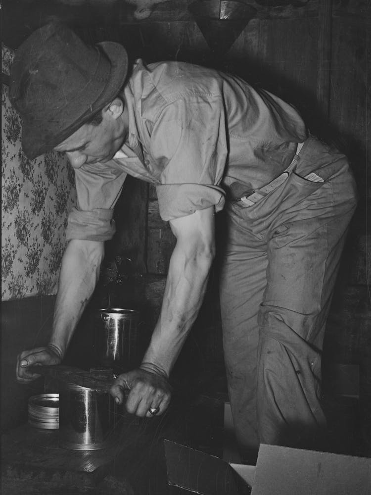 Pressing Top Onto Tin Can Full Of Syrup, Syrup Mill Near New Iberia, Louisiana By Russell Lee
