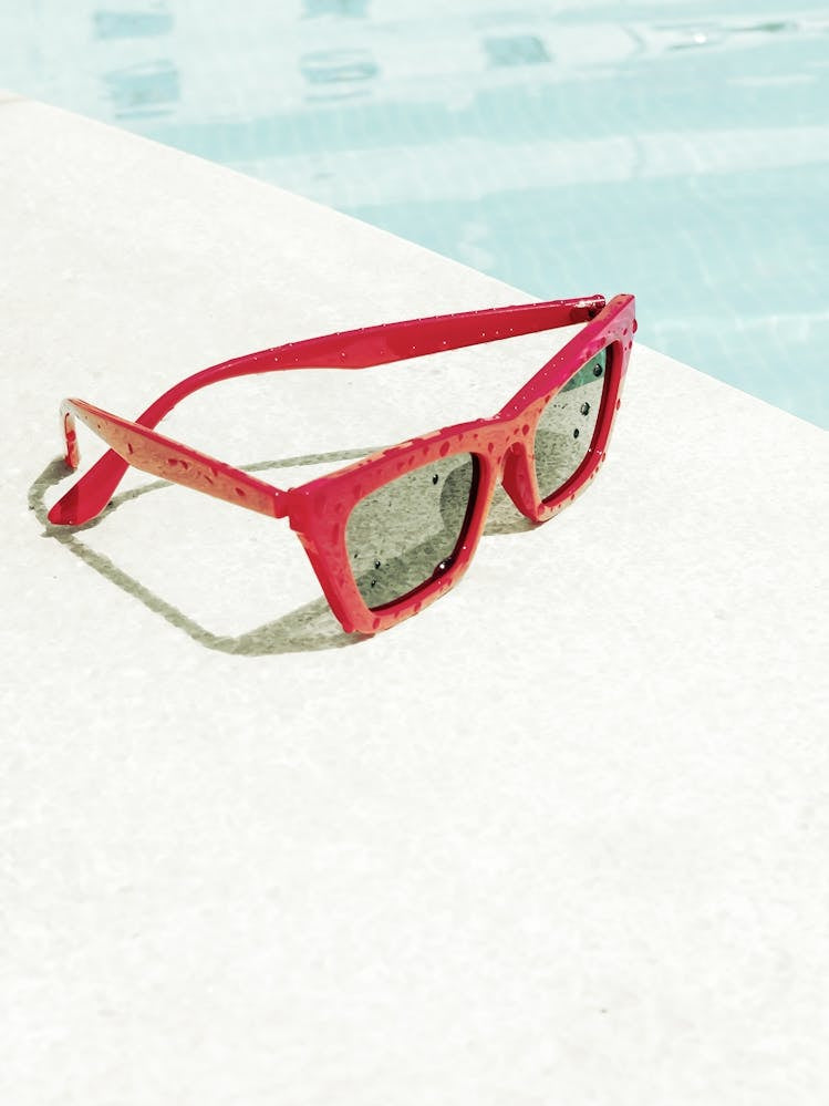 Red Sunglasses by the Pool_2262144