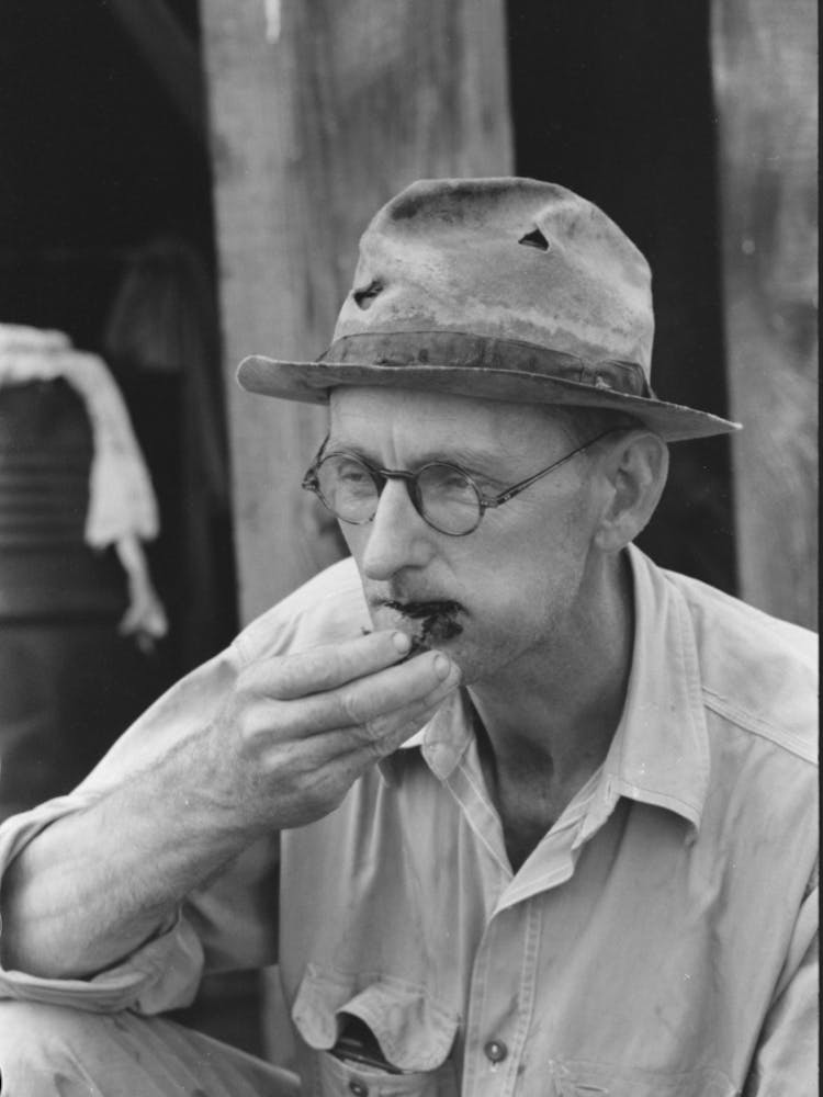 Roustabout Taking Chew Of Tobacco, Seminole Oil Field, Oklahoma By Russell Lee