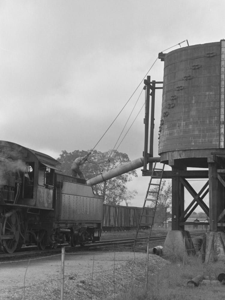 Locomotive Taking On Water, Port Barre, Louisiana By Russell Lee