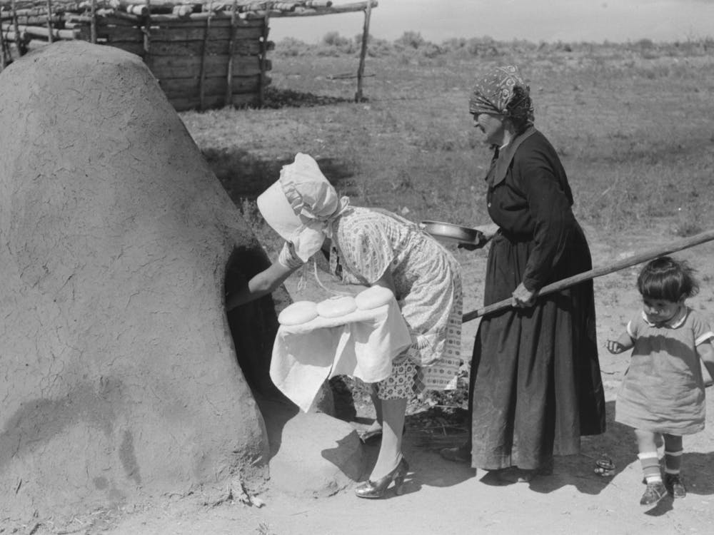 Untitled Photo, Possibly Related To Spanish American Woman Putting Loaf Of Bread Into Oven, Taos County, New