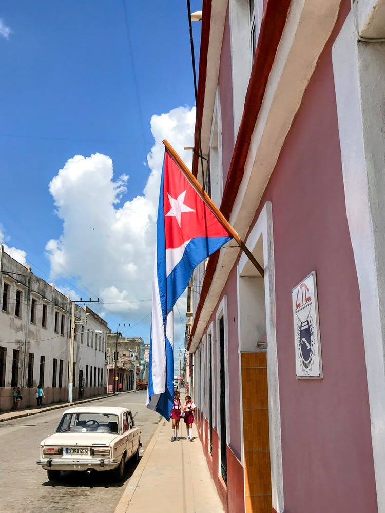 Cuban Flag And School Girls in Cienfuegos (Cuba Series)