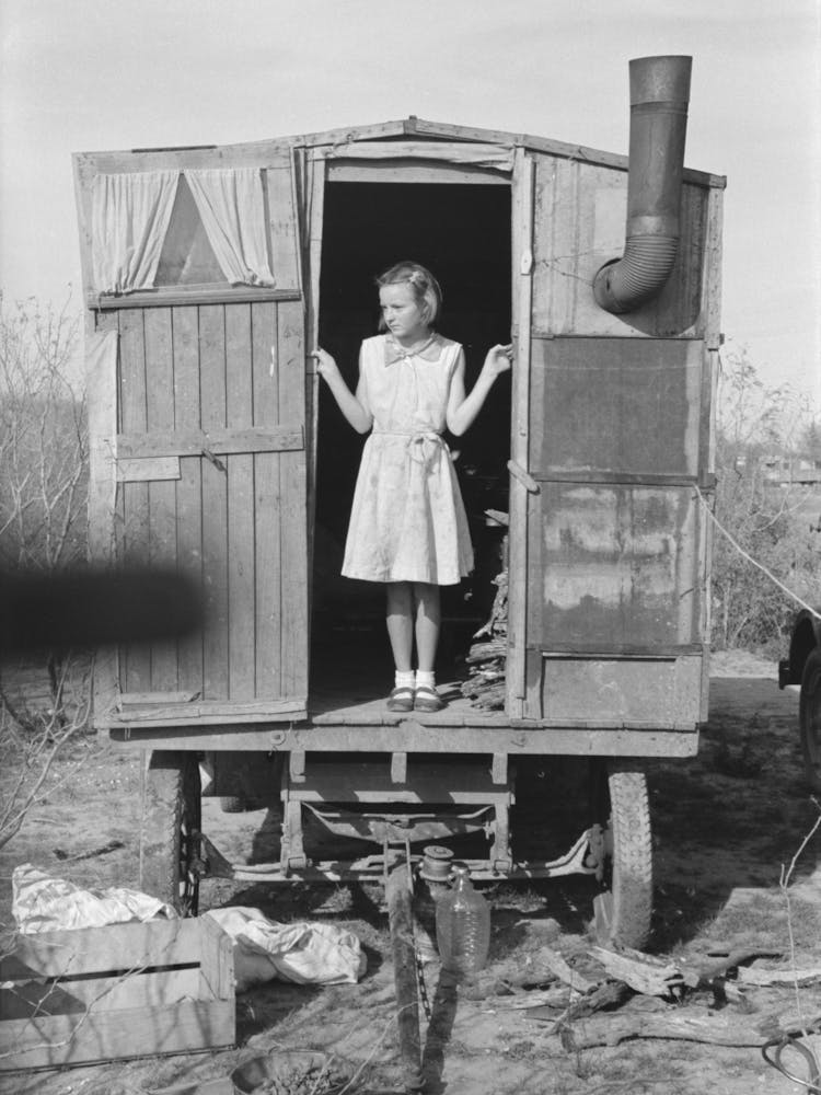 Daughter Of Migrant In Doorway Of Trailer, Sebastin, Texas By Russell Lee