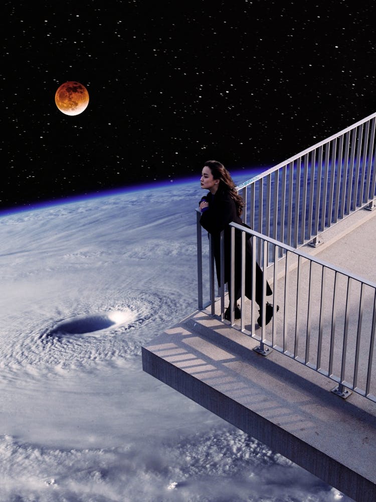 Woman Standing On Balcony Overlooking Earth Vortex