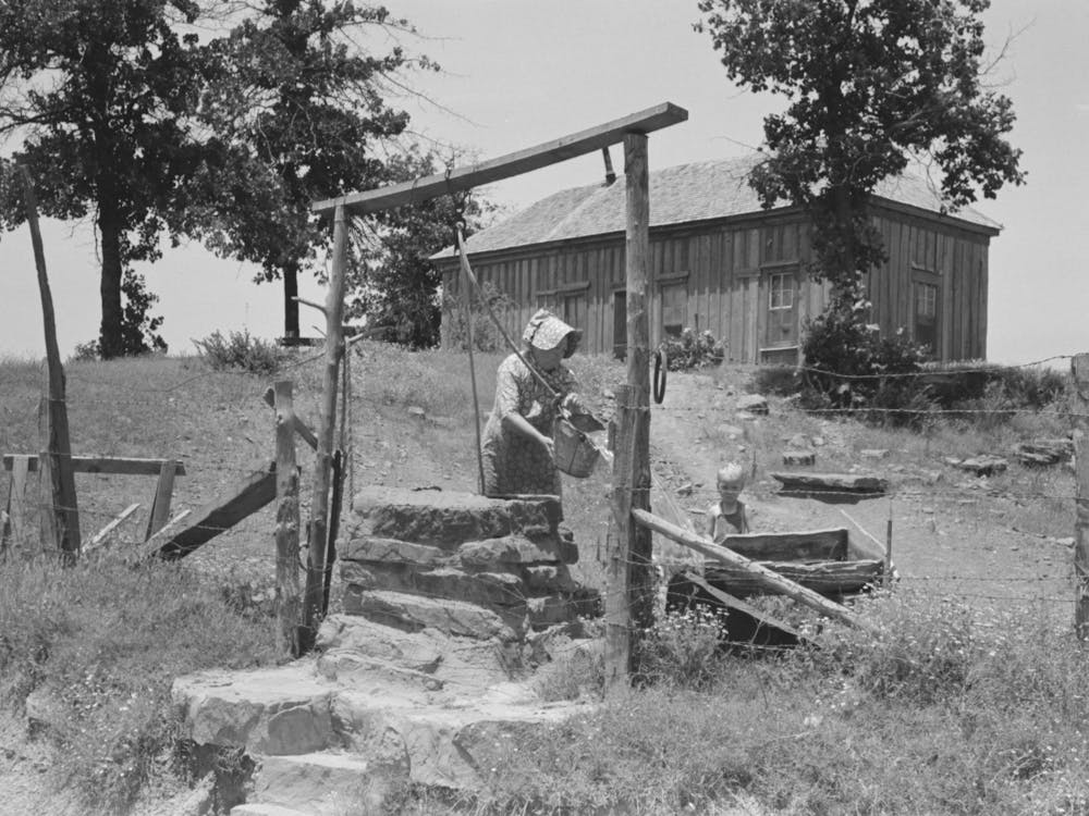 Tenant Farmer Drawing Water At Well, This Woman (Her Husband Died Several Months Ago) And Her Three Grown Son