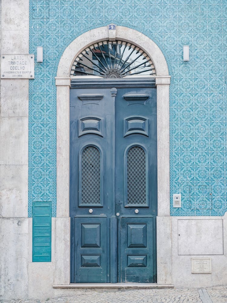 The blue door nr. 9 in Lisbon, Portugal - vintage and retro door and azulejos travel photography by Christa Stroo