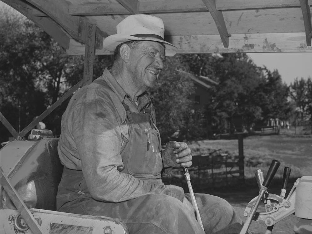 Wheat Farmer On Caterpillar Tractor Used To Draw Combine, Whitman County, Washington By Russell Lee