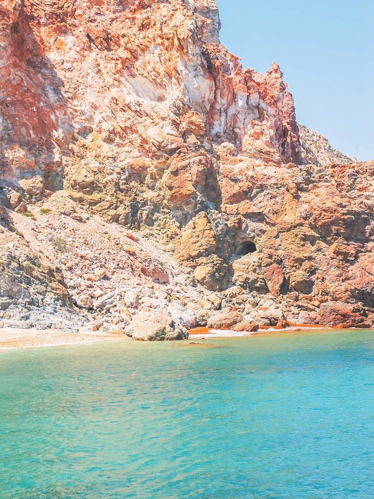 Milos, Greece I Nature beach paradise of red sand in the mountains and clear turquoise blue water in Cyclades islands with a pastel summer aesthetic for colorful minimalist geometric fine art photography