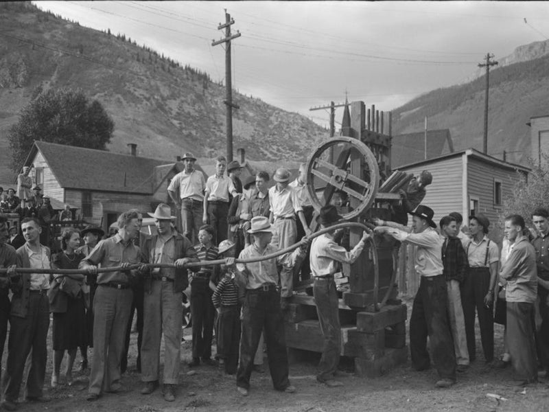 Untitled Photo, Possibly Related To Miner Attaching Airhose To Power Drill Which He Will Use In Drilling Contest,