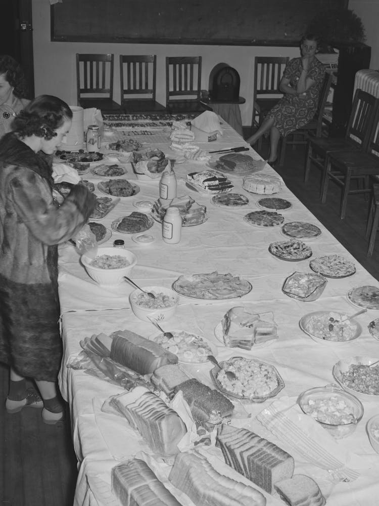 Wife Of Jaycee Member Bringing Food To The Buffet Supper At The High School, Eufaula, Oklahoma