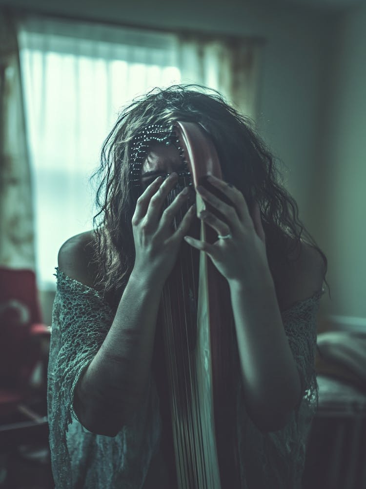 Woman Covers Her Face