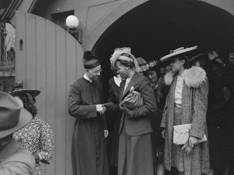 Shaking Hands With Members Of The Congregation After Services At An Episcopal Church, South Side Of