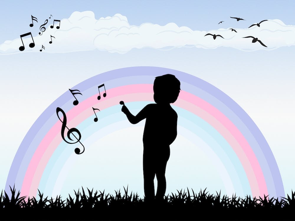 Boy Drawing On A Rainbow