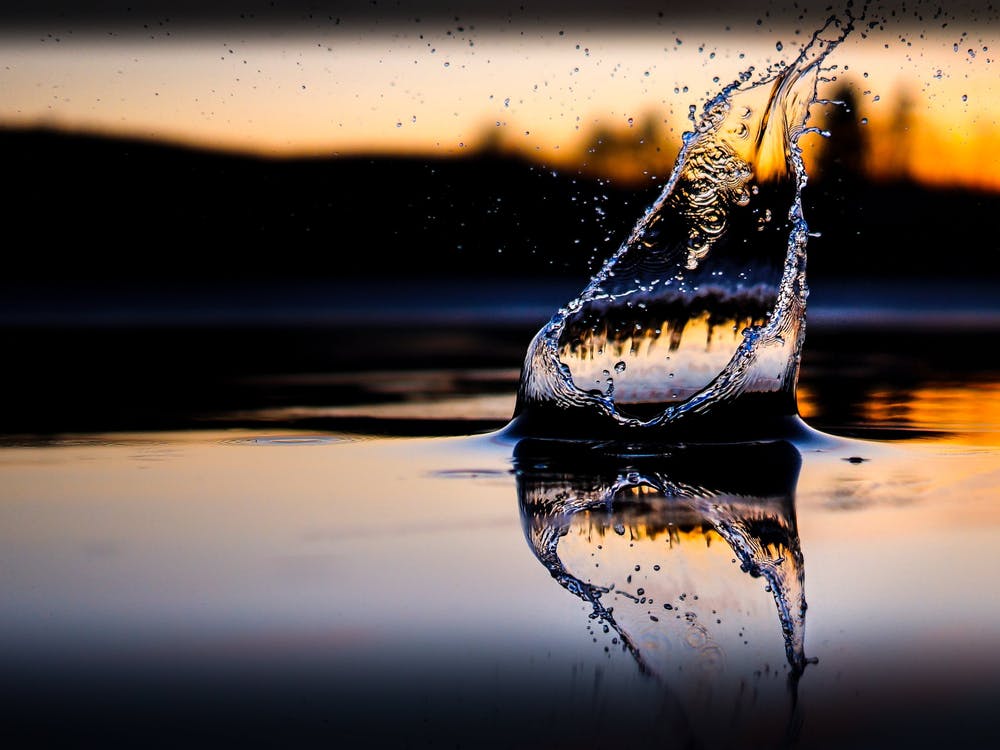 Water Splash At Sunset