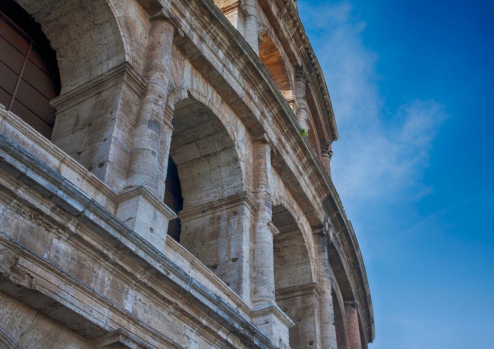 Colosseum With Blue Sky In Rome